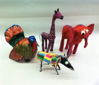 sculpture of giraffe, elephant, turkey, and goat